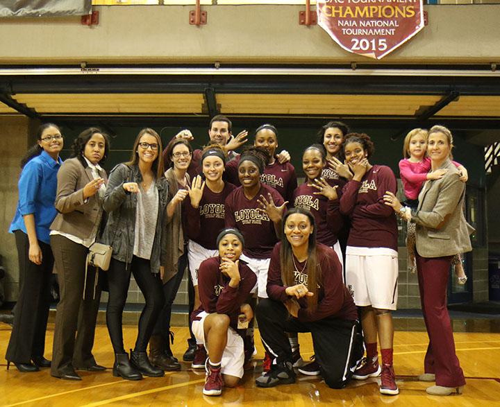Loyola 2014-15 women's basketball team gathered after Saturday's victory to collect their rings commemorating their success. The Wolfpack made it to the SSAC national tournament.