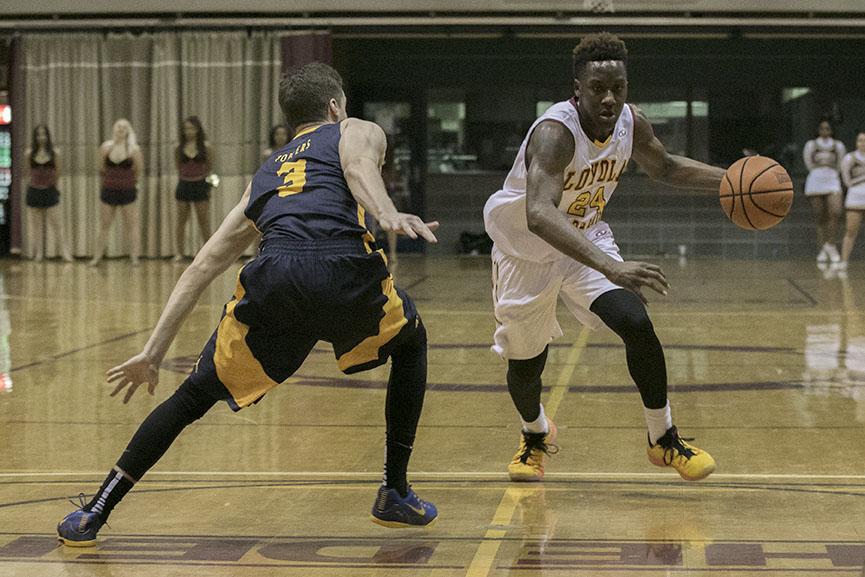 Loyola freshman guard Tre'Von Jasmine drives to the lane against Blue Mountain College in the Den. Jasmine scored 19 points in a 54-46 victory.