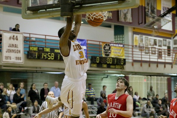 Johnny Griffin Jr., Loyola junior guard, dunks the ball off an alley-oop against Martin Methodist University. Loyola beat Martin Methodist, an SSAC rival, 64-54, bringing their overall record to 12-10 and a conference record of 7-7.